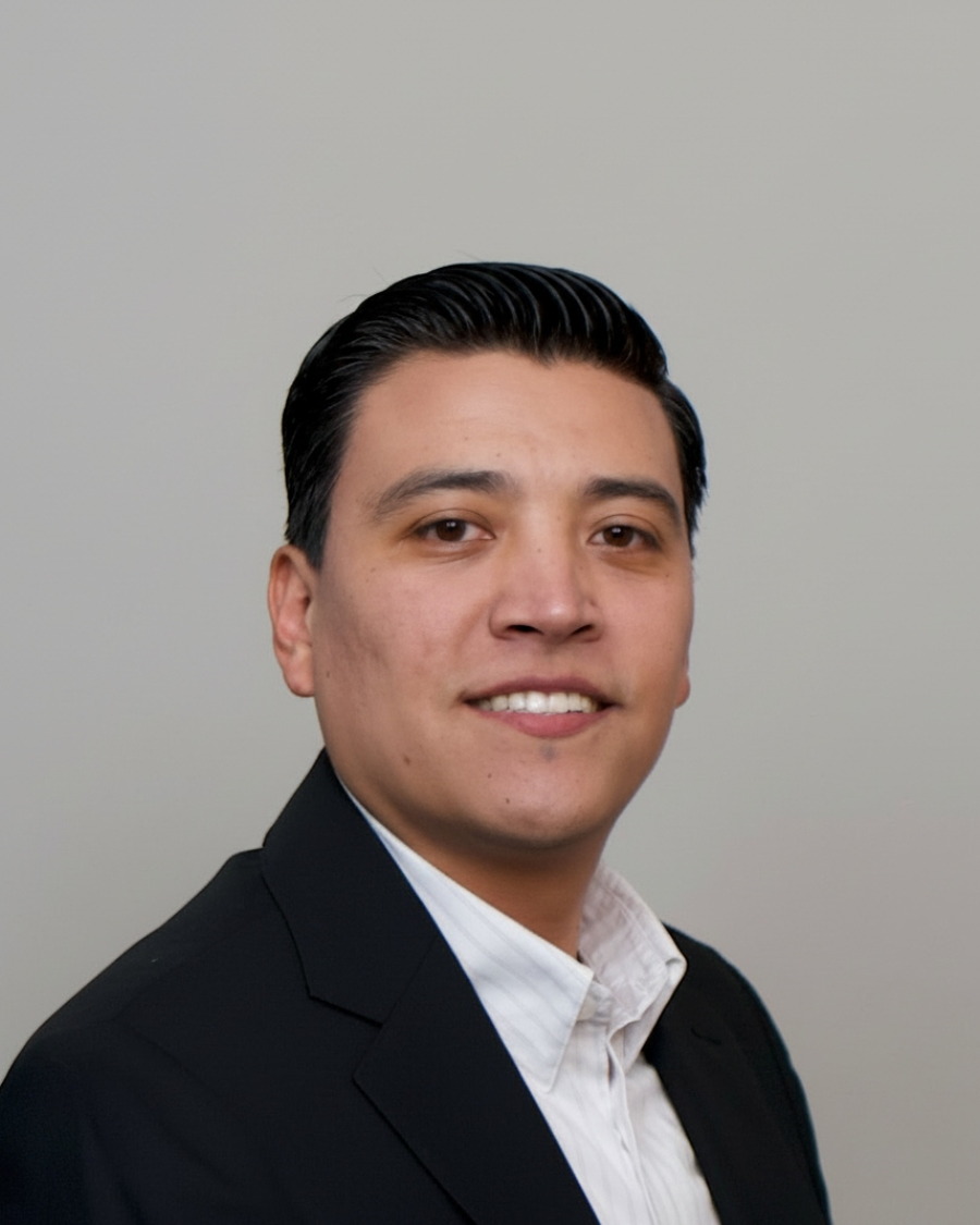 Eli, founder of Credit with Eli, in a dark suit